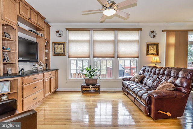 107 Washington Square Ct, Occoquan, VA 22125 - living area featuring plenty of natural light, ornamental molding, and light wood-style flooring