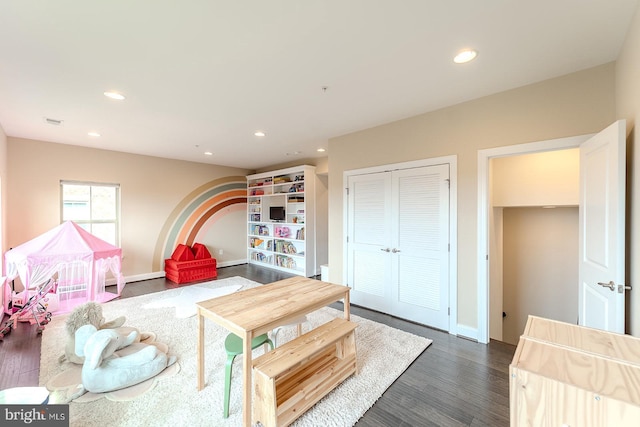 game room featuring dark wood-type flooring, visible vents, recessed lighting, and baseboards