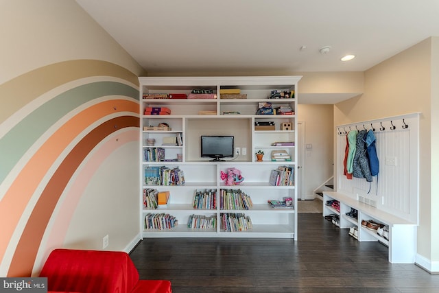 interior space with wood finished floors, recessed lighting, and baseboards