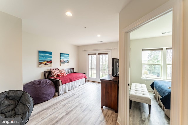 bedroom featuring recessed lighting, visible vents, access to outside, and wood finished floors