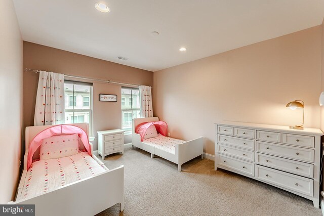 bedroom with visible vents, recessed lighting, baseboards, and light carpet