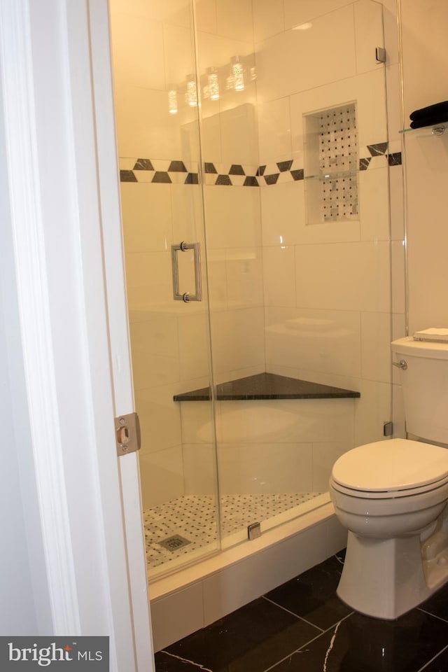 8074 Windward Key Dr, Chesapeake Beach, MD 20732 - bathroom with toilet, a shower stall, and tile patterned flooring