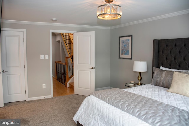 8074 Windward Key Dr, Chesapeake Beach, MD 20732 - bedroom with crown molding, baseboards, and carpet flooring