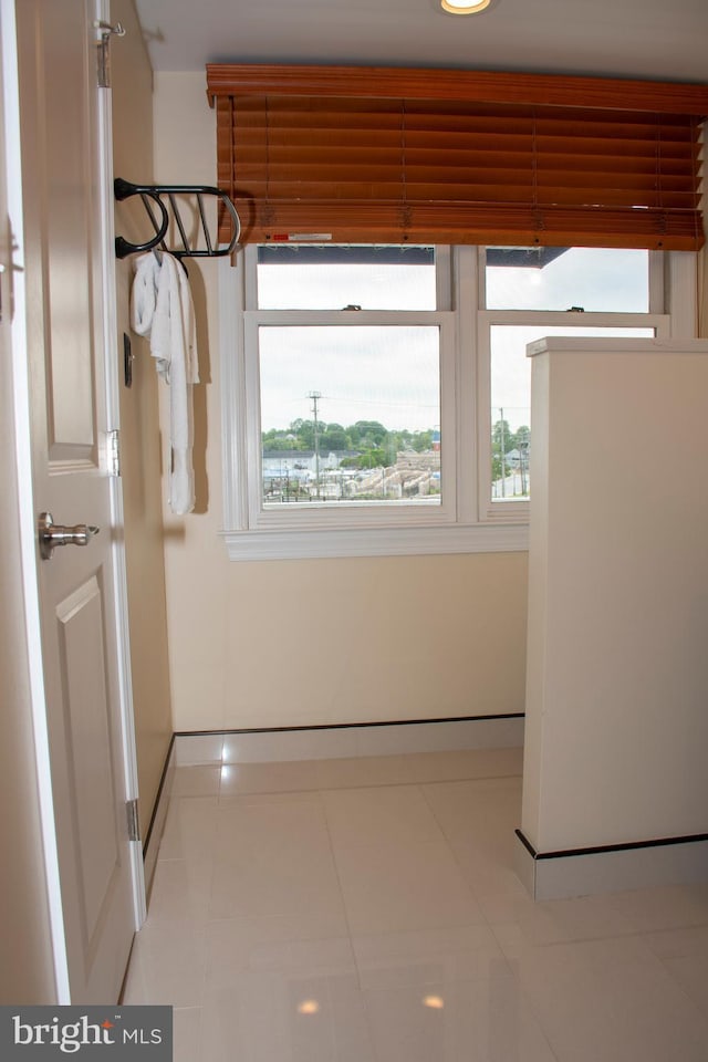 8074 Windward Key Dr, Chesapeake Beach, MD 20732 - corridor with baseboards and tile patterned flooring