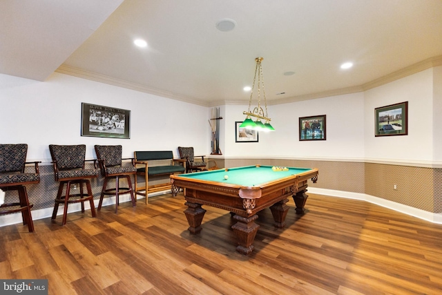game room with wood finished floors, a wainscoted wall, ornamental molding, and pool table