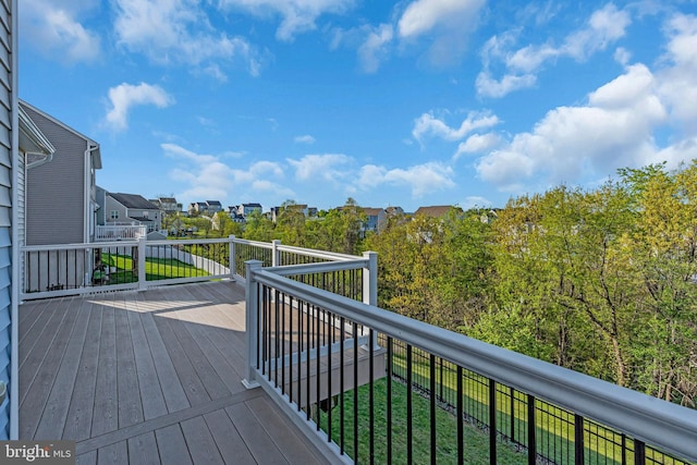wooden terrace with a residential view
