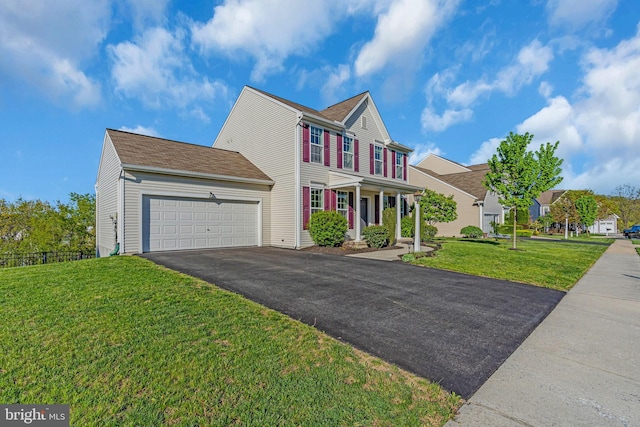 view of front facade with covered porch, a garage, fence, aphalt driveway, and a front lawn