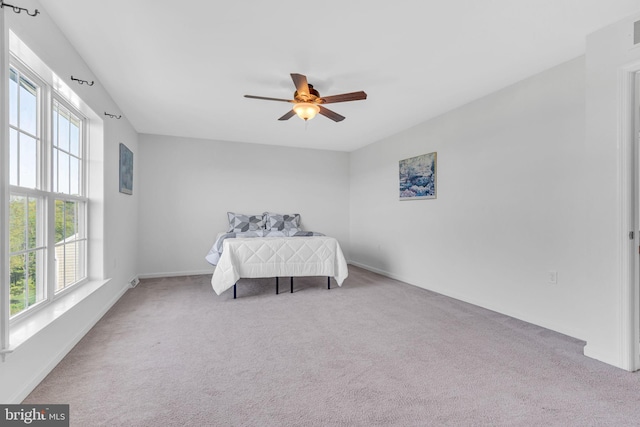 bedroom featuring baseboards, ceiling fan, carpet, and visible vents