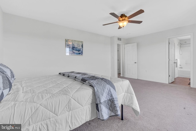 bedroom with visible vents, baseboards, ceiling fan, connected bathroom, and carpet