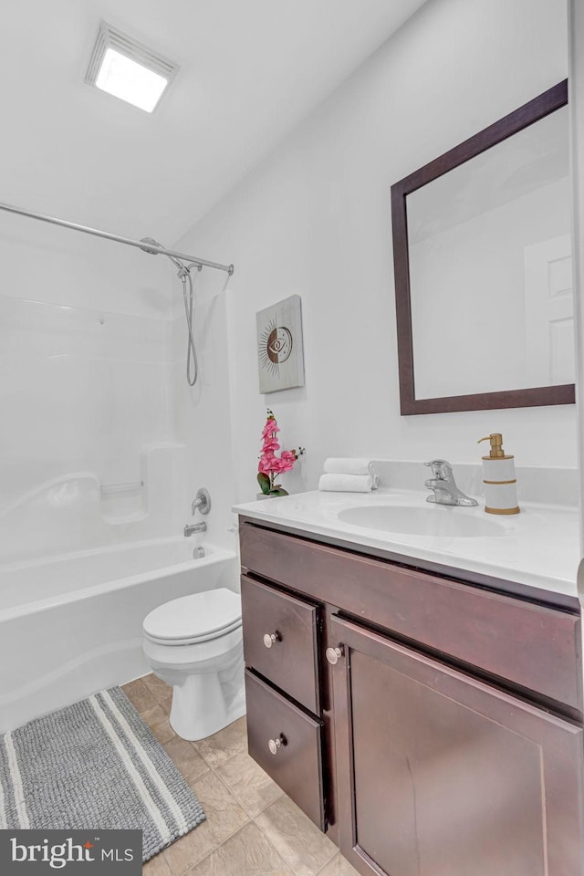bathroom with toilet, tile patterned floors, tub / shower combination, and vanity
