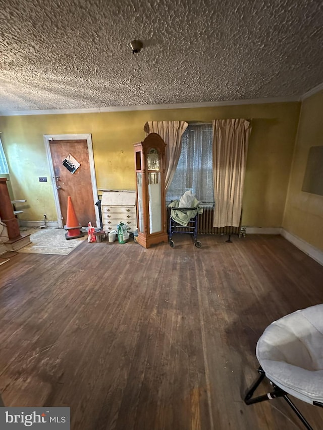 interior space featuring wood-type flooring and baseboards
