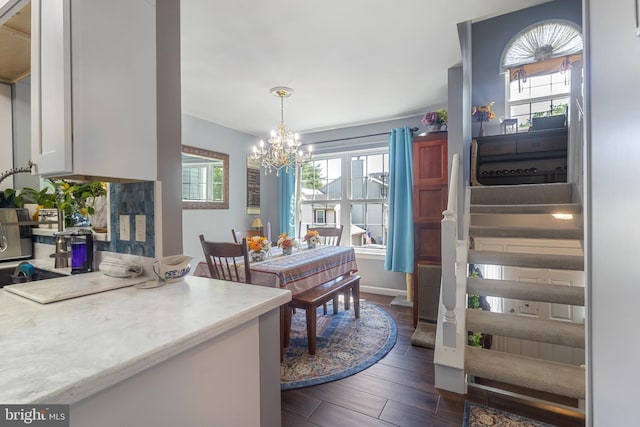 10230 Faire Commons Ct, Burke, VA 22015 - dining area featuring dark wood-style floors and a notable chandelier