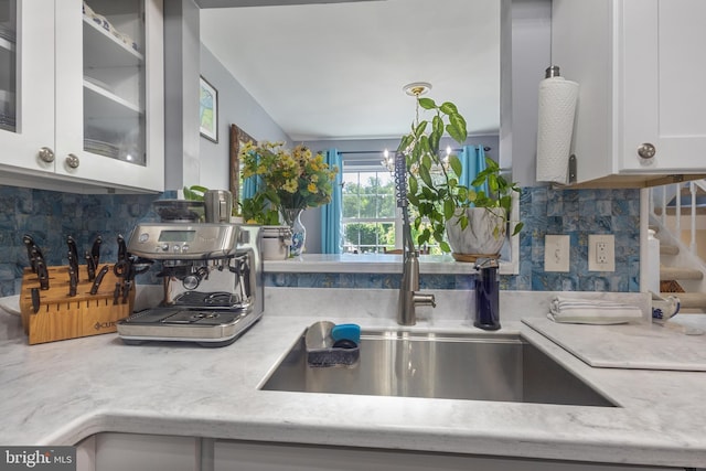 10230 Faire Commons Ct, Burke, VA 22015 - kitchen with a sink, backsplash, white cabinets, and glass insert cabinets