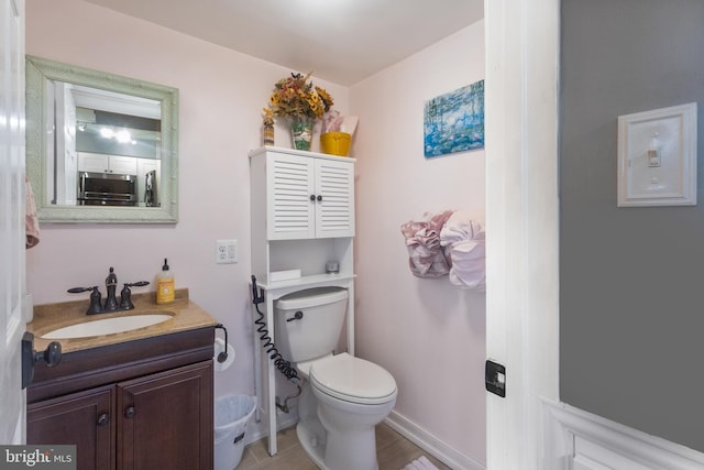 10230 Faire Commons Ct, Burke, VA 22015 - bathroom featuring vanity, baseboards, and toilet