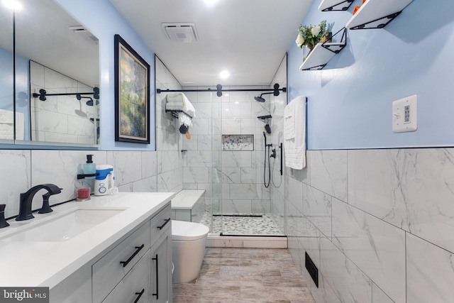 10230 Faire Commons Ct, Burke, VA 22015 - full bath featuring vanity, tile walls, a stall shower, and toilet