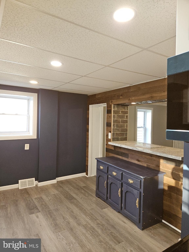 4216 Post Rd, Trainer, PA 19061 - kitchen featuring blue cabinets, visible vents, light wood-type flooring, and a drop ceiling