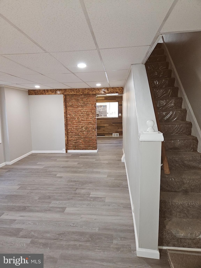 4216 Post Rd, Trainer, PA 19061 - basement featuring stairway, baseboards, recessed lighting, wood finished floors, and a paneled ceiling