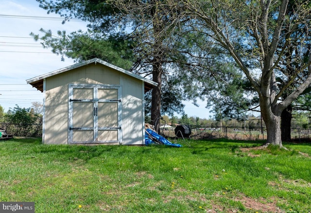 view of shed with fence
