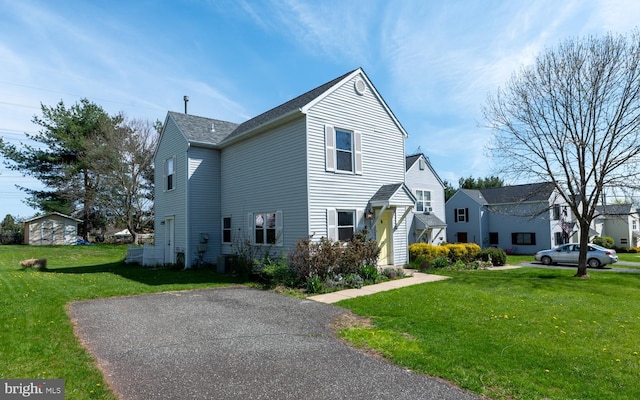 view of front of home featuring a front lawn