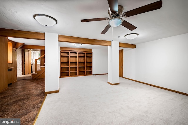 basement featuring baseboards, carpet, a ceiling fan, and stairs