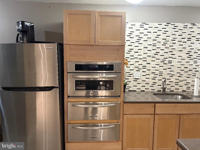 1900 Lyttonsville Rd Unit 1006, Silver Spring, MD 20910 - kitchen featuring a sink, appliances with stainless steel finishes, a warming drawer, and dark countertops