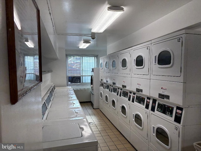 1900 Lyttonsville Rd Unit 1006, Silver Spring, MD 20910 - common laundry area featuring separate washer and dryer, light tile patterned flooring, and stacked washer / dryer