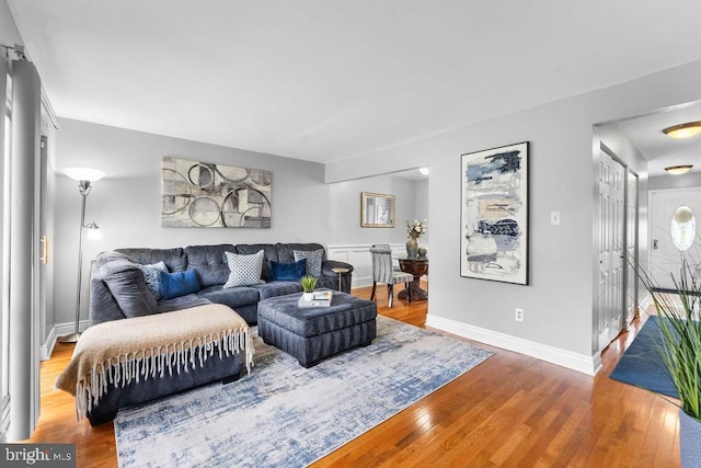 living room featuring wood finished floors and baseboards