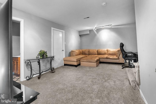 living room with visible vents and carpet