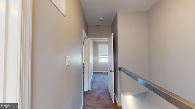 903 K St NE, Washington, DC 20002 - hall with an upstairs landing, visible vents, dark carpet, and baseboards