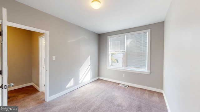 903 K St NE, Washington, DC 20002 - spare room with visible vents, carpet flooring, and baseboards