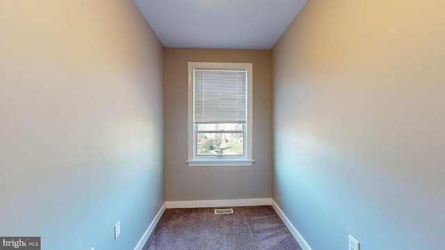903 K St NE, Washington, DC 20002 - unfurnished room featuring visible vents, dark colored carpet, and baseboards