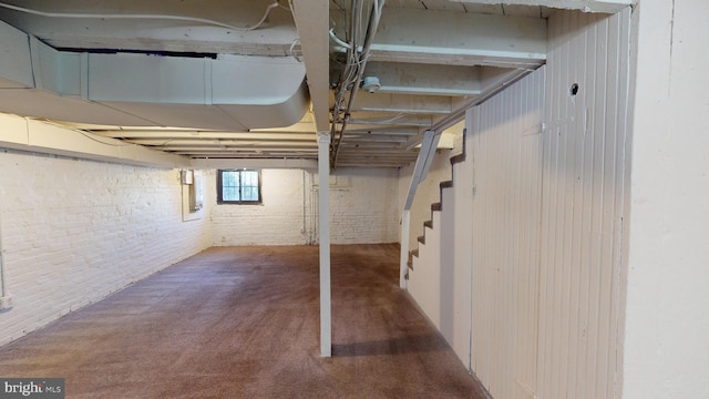 903 K St NE, Washington, DC 20002 - basement with stairway, carpet floors, and brick wall