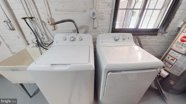 903 K St NE, Washington, DC 20002 - washroom with water heater and washer and clothes dryer