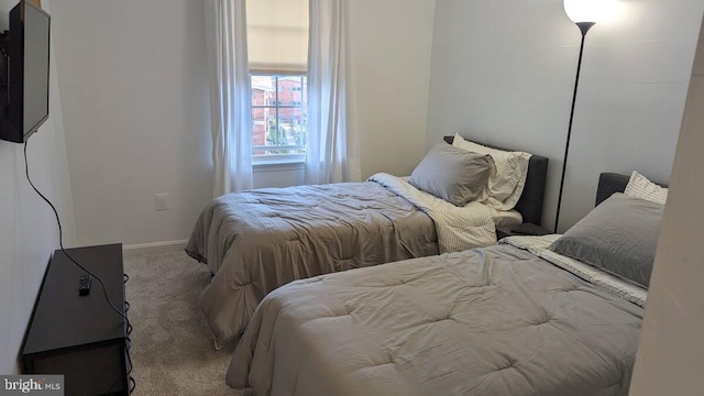 carpeted bedroom with baseboards