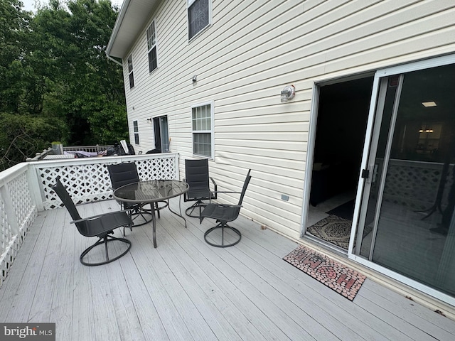 6065 64th Ave Unit 10, Riverdale, MD 20737 - wooden deck featuring outdoor dining area