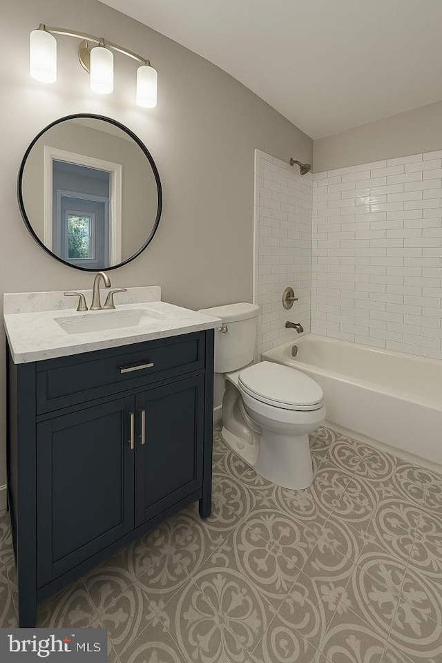 bathroom with toilet,  shower combination, tile patterned floors, and vanity