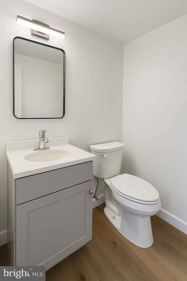 5872 Steepridge Dr Unit 20-04, Elkridge, MD 21075 - half bath featuring toilet, baseboards, wood finished floors, and vanity