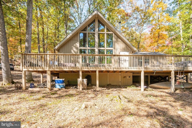 back of property featuring a deck
