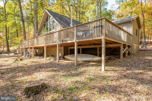 back of house featuring a wooden deck