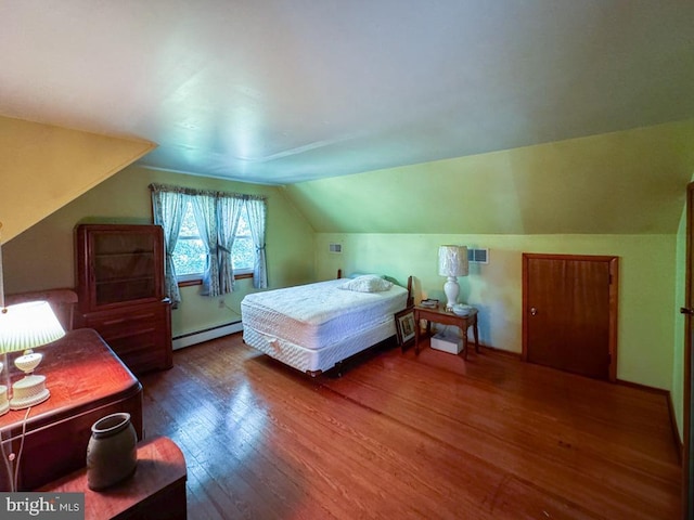 4564 Mountain Rd, Pasadena, MD 21122 - bedroom with a baseboard radiator, wood finished floors, and vaulted ceiling