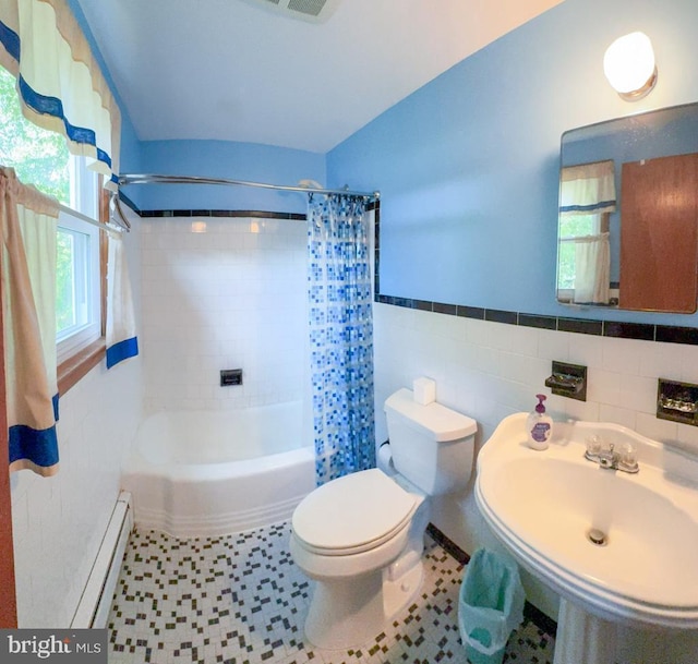 4564 Mountain Rd, Pasadena, MD 21122 - full bathroom with toilet, shower / tub combo with curtain, a baseboard radiator, a wainscoted wall, and tile walls