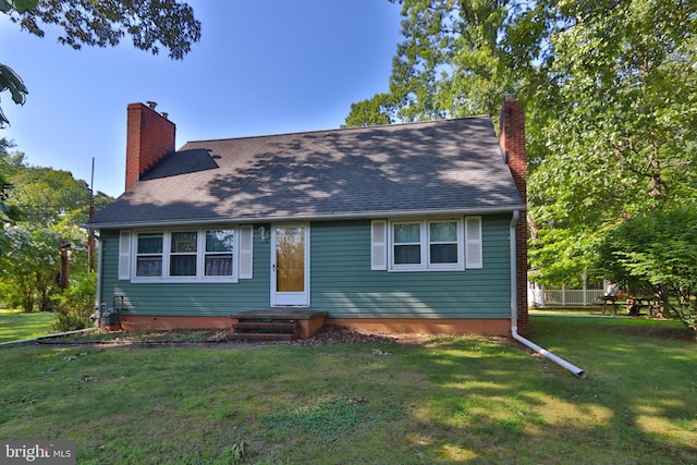 4564 Mountain Rd, Pasadena, MD 21122 - view of front of house featuring a chimney and a front lawn