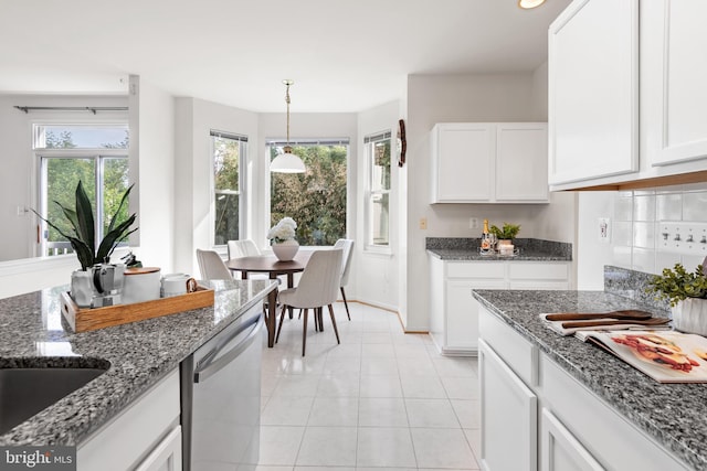 206 Cherrywood Ter, Gaithersburg, MD 20878 - kitchen with stainless steel dishwasher, white cabinetry, and healthy amount of natural light