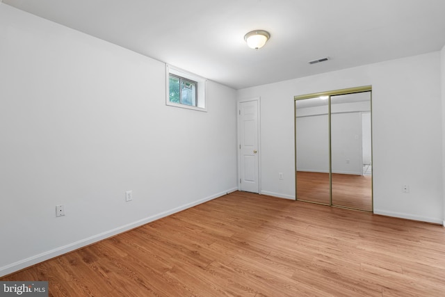 206 Cherrywood Ter, Gaithersburg, MD 20878 - unfurnished bedroom featuring light wood-style floors, baseboards, and a closet
