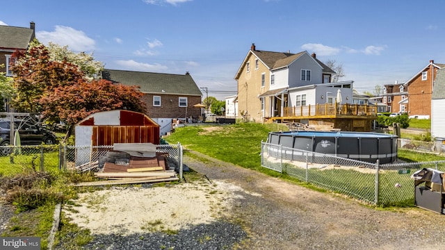 326 Glasgow St, Pottstown, PA 19464 - exterior space featuring fence private yard, a fenced in pool, a storage shed, a yard, and a residential view