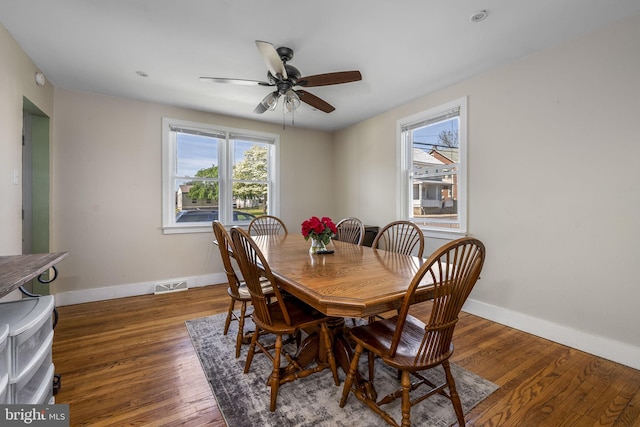 326 Glasgow St, Pottstown, PA 19464 - dining area featuring baseboards, visible vents, a healthy amount of sunlight, and wood finished floors