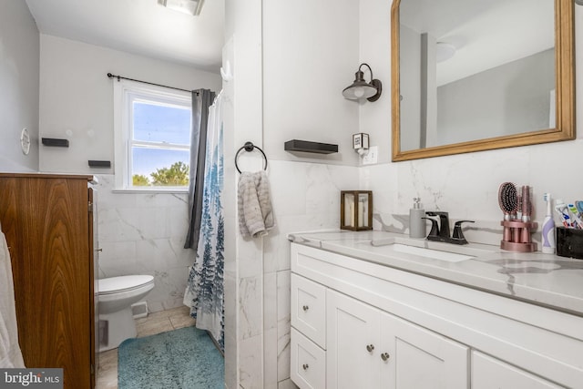 326 Glasgow St, Pottstown, PA 19464 - full bath featuring wainscoting, tile patterned flooring, vanity, toilet, and tile walls