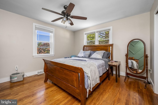 326 Glasgow St, Pottstown, PA 19464 - bedroom with baseboards, ceiling fan, wood finished floors, and visible vents