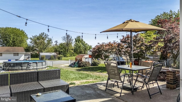 326 Glasgow St, Pottstown, PA 19464 - view of patio with an outdoor structure, an outdoor pool, a shed, and outdoor dining space
