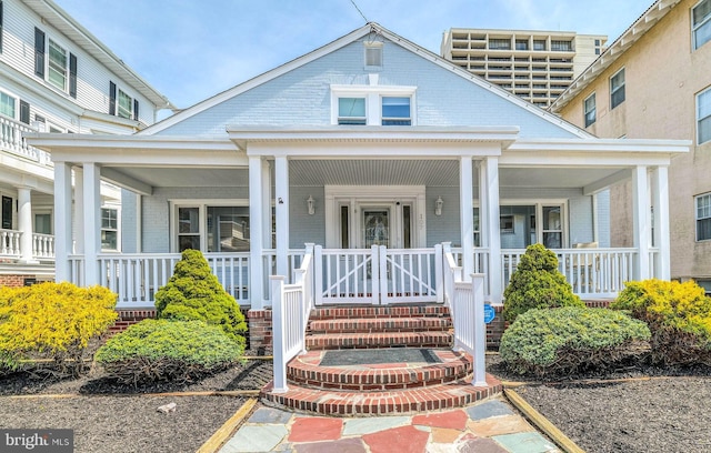 107 S Dover Ave, Atlantic City, NJ 08401 - doorway to property with covered porch and brick siding